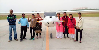 Computer course students on a trip to the airstrip for a glider ride